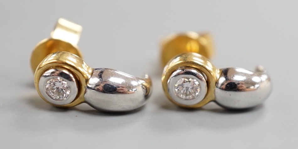 A modern pair of two colour 750 metal and single stone diamond set earrings, 12mm, gross weight 2.9 grams.